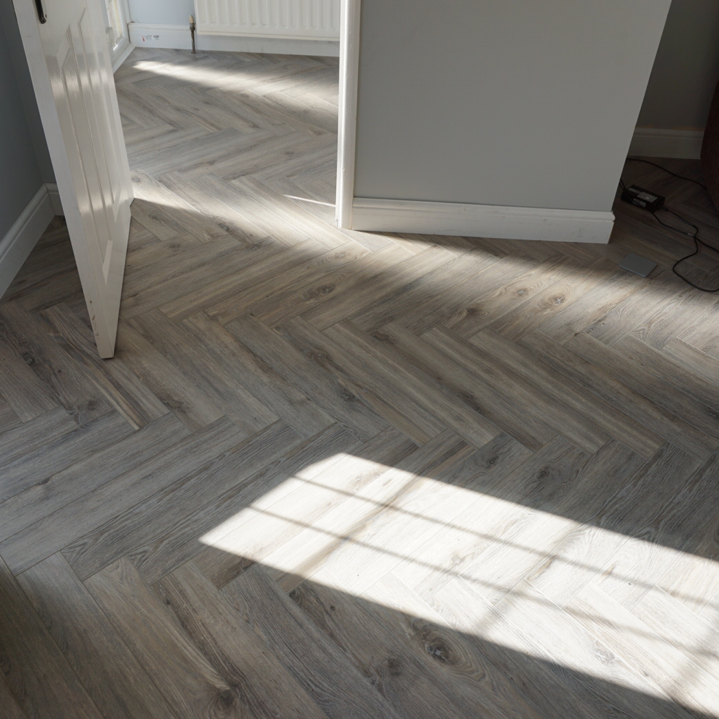 Fusion Herringbone 12mm Tornado Grey Oak 4V Laminate Flooring