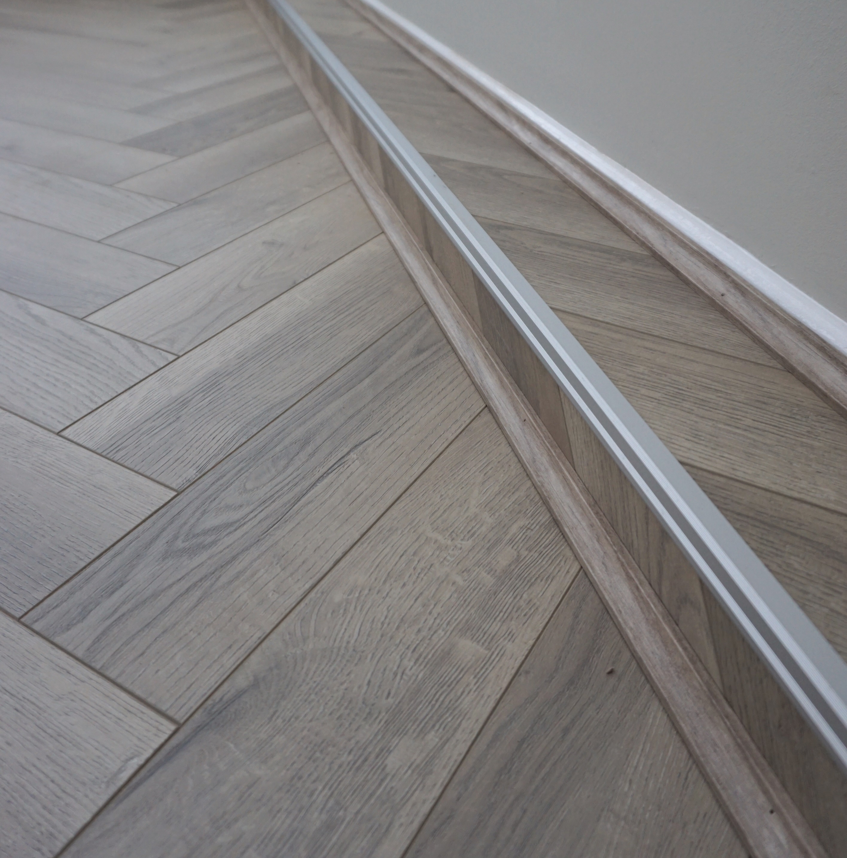 Fusion Herringbone 12mm Grey Beige Oak 4V Laminate Flooring