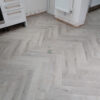 Fusion Herringbone 12mm Embossed Grey Oak 4V Laminate Flooring