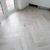 Fusion Herringbone 12mm Embossed Grey Oak 4V Laminate Flooring