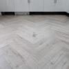 Fusion Herringbone 12mm Embossed Grey Oak 4V Laminate Flooring