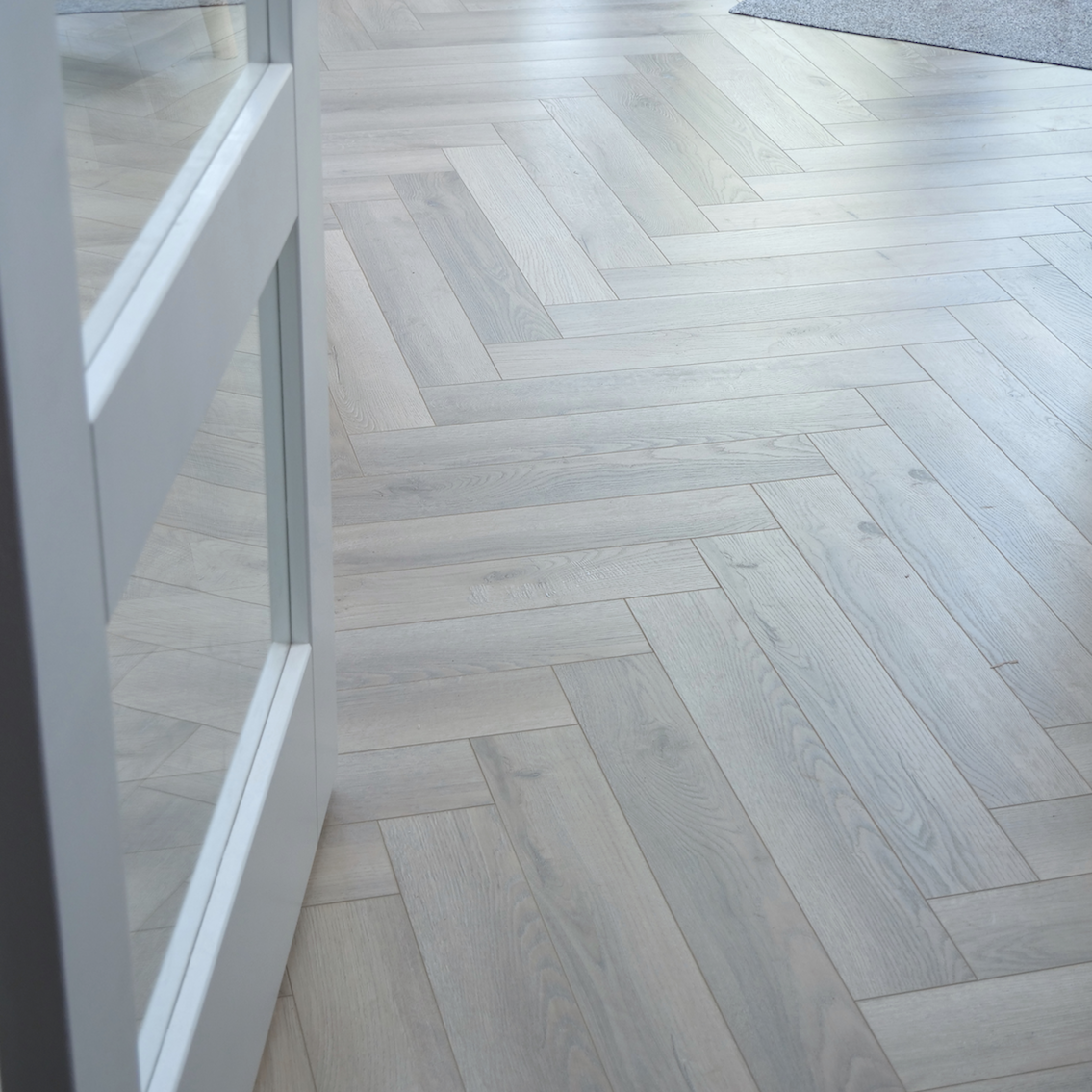 Fusion Herringbone 12mm Embossed Grey Oak 4V Laminate Flooring