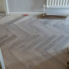 Craft AC5 Herringbone 12mm Castle Grey Oak Laminate Flooring