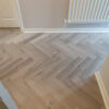 Craft AC5 Herringbone 12mm Castle Grey Oak Laminate Flooring